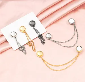 Detailed view of metal magnetic trouser hem clips with chains, practical fixing tool.