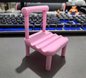 Pink chair mobile phone holder, cute desktop stand for smartphone and lazy video watching.