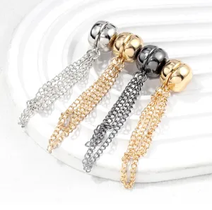 Detailed view of magnetic pant clips with metal chains, stylish trousers hem cinch tool.