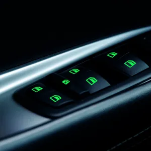 Luminous car window switch sticker, glowing button decal for auto interior decoration.