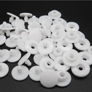 White plastic snap fasteners, durable button clips for protective face masks and elastic straps.