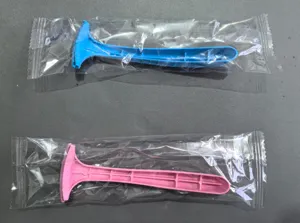 Detail shot of household foot pedicure knife with blue and pink plastic packaging.