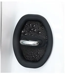 Car door lock protector cover detail showing black silicone and metallic buckle close-up.