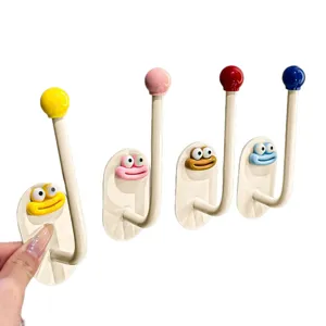 Punch-free cute cartoon wall hook adhesive hanging rack for bathroom and bedroom storage.