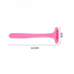 Pink plastic foot callus shaver and pedicure tool with ergonomic handle, isolated on white.