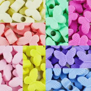 Detailed close-up view of vibrant acrylic butterfly beads in various colors for DIY crafts.