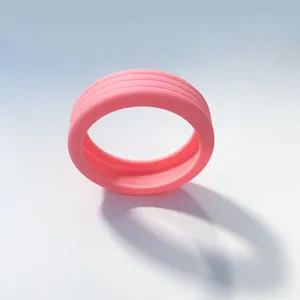 Pink silicone luggage wheel cover detail view, durable wear-resistant suitcase caster protector.
