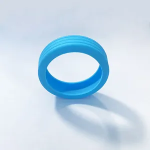 Silicone luggage suitcase wheel protector detail view, flexible blue caster cover part.
