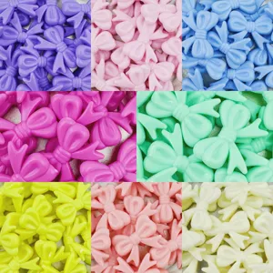 Detailed closeup of colorful acrylic bow beads, perfect for DIY bracelets and hair accessories.