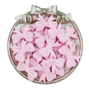 Cute pink acrylic bow beads for DIY jewelry making, charm bracelets, and cute crafts.