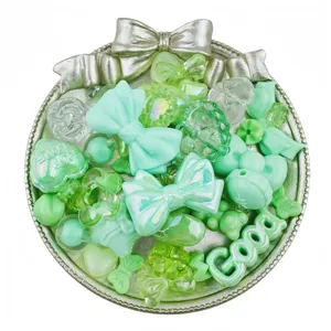 Mixed mint green acrylic beads and cute charm pendants for DIY jewelry and phone chains.