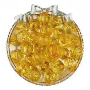 Acrylic transparent yellow beads detail showing glossy surface texture for DIY jewelry making.