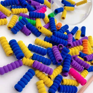 Colorful sponge pencil grips detail shot, soft foam threaded anti slip pen holder for students.