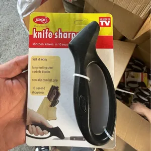 Handheld knife sharpener compact kitchen tool with ergonomic grip for fast sharpening.