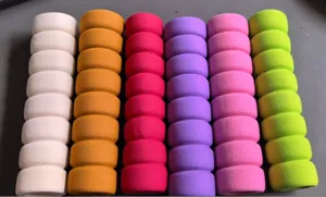 Colorful foam door handle cover detail view showing soft wavy grip texture and bright hues.