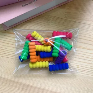 Colorful sponge pencil grips with anti-slip threaded design for students writing comfort.
