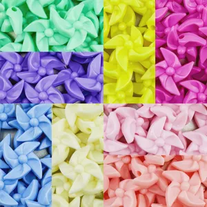 Close-up detail of colorful acrylic pinwheel beads, perfect for DIY handmade jewelry crafts.