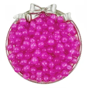 Acrylic jelly round beads detail view, vibrant pink DIY jewelry making accessories for bracelets.