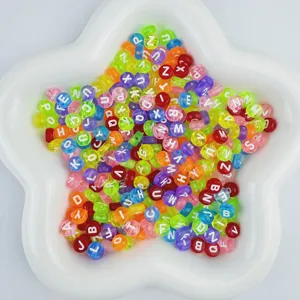 Closeup of colorful acrylic alphabet beads in a star tray, perfect for DIY handmade jewelry.