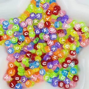 Close-up of colorful acrylic letter beads with white alphabet prints for DIY bracelets.