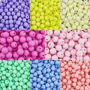 Close-up detail of colorful frosted acrylic round beads, perfect for DIY handmade jewelry crafting.