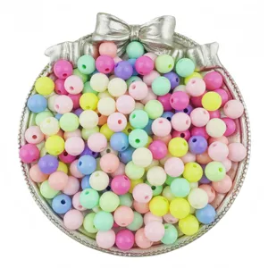 Detailed view of colorful acrylic round beads for DIY handmade jewelry bracelets and necklaces.