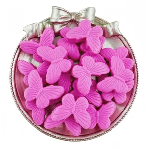 Close-up detail of vibrant pink acrylic butterfly beads with vertical holes, perfect for DIY jewelry.