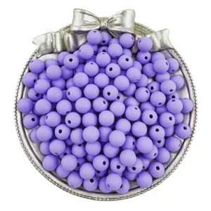 Detailed view of matte purple round beads in a silver bow tray, ideal for DIY jewelry making accessories.