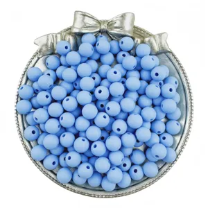 Light blue matte round acrylic beads with straight holes for DIY jewelry making and crafting.