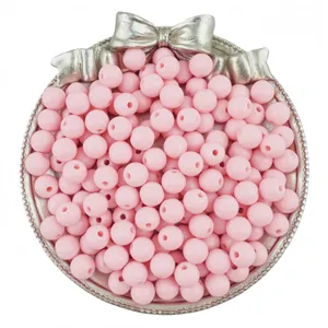 Pink acrylic round loose beads for DIY jewelry making, handmade bracelets and necklaces detail view.
