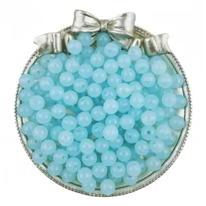 Detail view of light blue jelly acrylic round beads, ideal for DIY bracelet crafting.