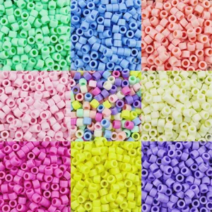 Detail view of 6x5mm acrylic barrel beads in various vibrant colors for DIY crafts.
