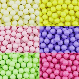 Close-up detail of colorful acrylic solid round beads for DIY handmade accessories.