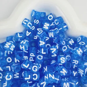 7x7mm blue acrylic alphabet cube beads detail shot showing translucent square letter charms for DIY