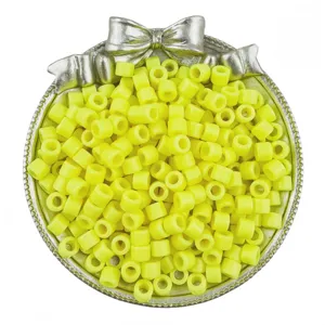 Yellow acrylic barrel beads detail shot for DIY bracelets and hair braiding accessories