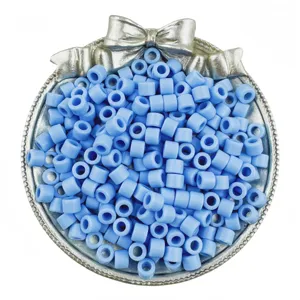 Close up of light blue acrylic barrel beads detail view, perfect for DIY jewelry making and crafts.