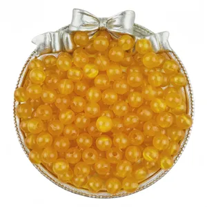 Detailed view of translucent jelly yellow acrylic round beads, perfect for DIY jewelry.