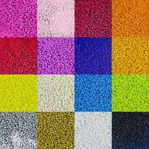 Close-up detail of colorful glass seed beads, assorted shades for DIY jewelry making.