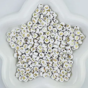 White acrylic letter beads with gold print, perfect for DIY friendship bracelets.