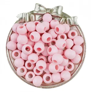 Pink acrylic large hole round beads detail view for DIY jewelry making and bracelet crafting.