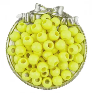 Detail view of yellow acrylic large hole round loose beads for DIY handmade jewelry accessories.