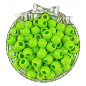 Detail shot of bright green large hole acrylic round beads for DIY jewelry making and crafts.