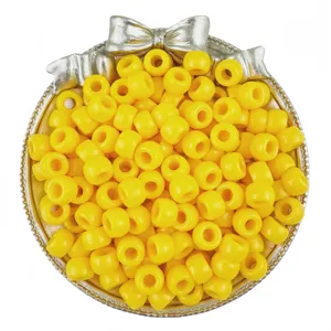 Yellow 6x9mm pony barrel beads in decorative silver bow container for DIY craft and hair braiding.