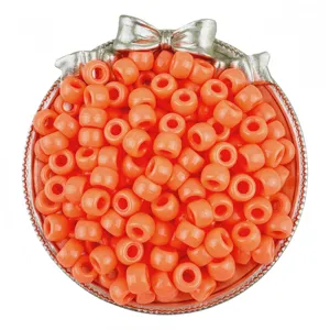 Close-up detail of vibrant orange pony beads, perfect for hair braiding and DIY jewelry making.