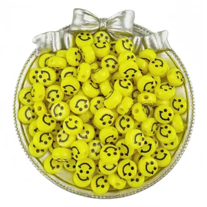 Yellow acrylic smiley face beads detail shot, ideal for DIY handmade bracelets and accessories.