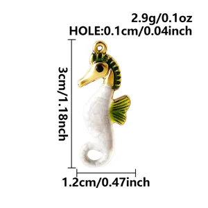 Detailed view of gold-plated enamel seahorse pendant with dimensions 3cm height and 0.1cm hole.