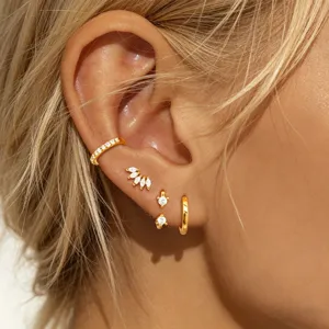 Detailed view of trendy gold-plated multi-piercing cubic zirconia earring set for women.