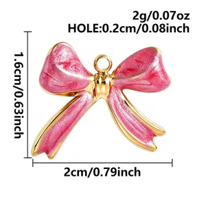 Pink enamel bow pendant charm for DIY jewelry making, cute metal necklace bracelet accessory.