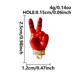 Roter Friedenszeichen Hand Anhänger Detailaufnahme, goldener Strasssockel, DIY Schmuck Accessoire.
