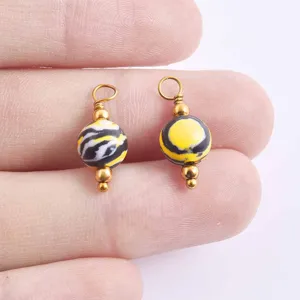 DIY Perlen Anhänger Zubehör, gelb-schwarze Marmorstein Perlen Charms für die Schmuckherstellung.